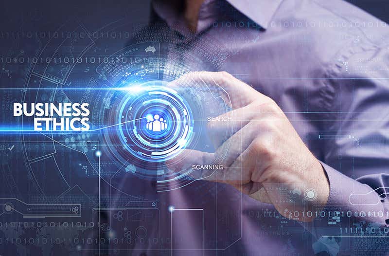 Business, Technology, Internet and network concept. Young businessman working on a virtual screen of the future and sees the inscription: business ethics Business, Technology, Internet and network concept. Young businessman working on a virtual screen of the future and sees the inscription: business ethics